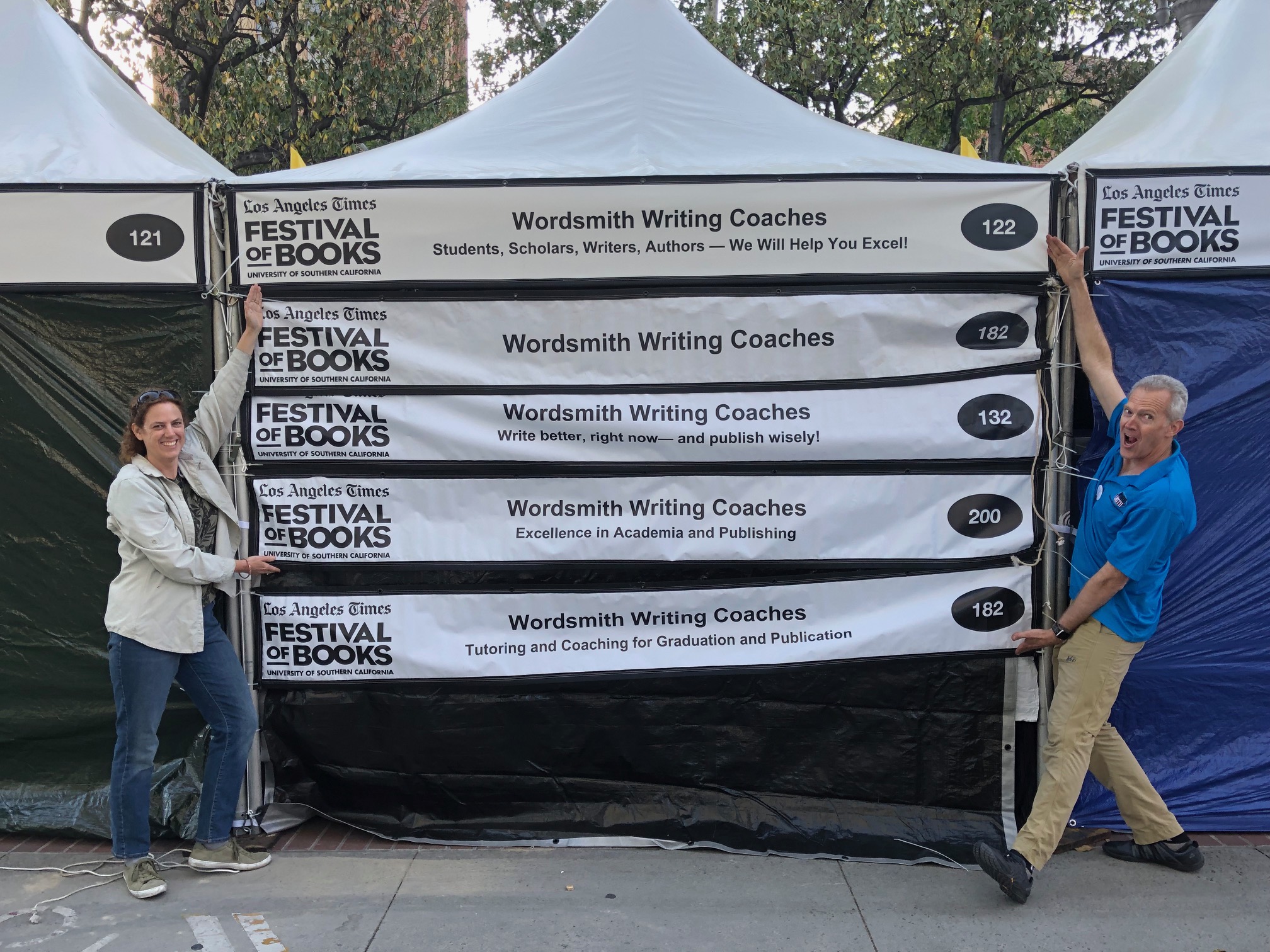five booth-banners from the first six years of WWC's participation in the Festival of Books!