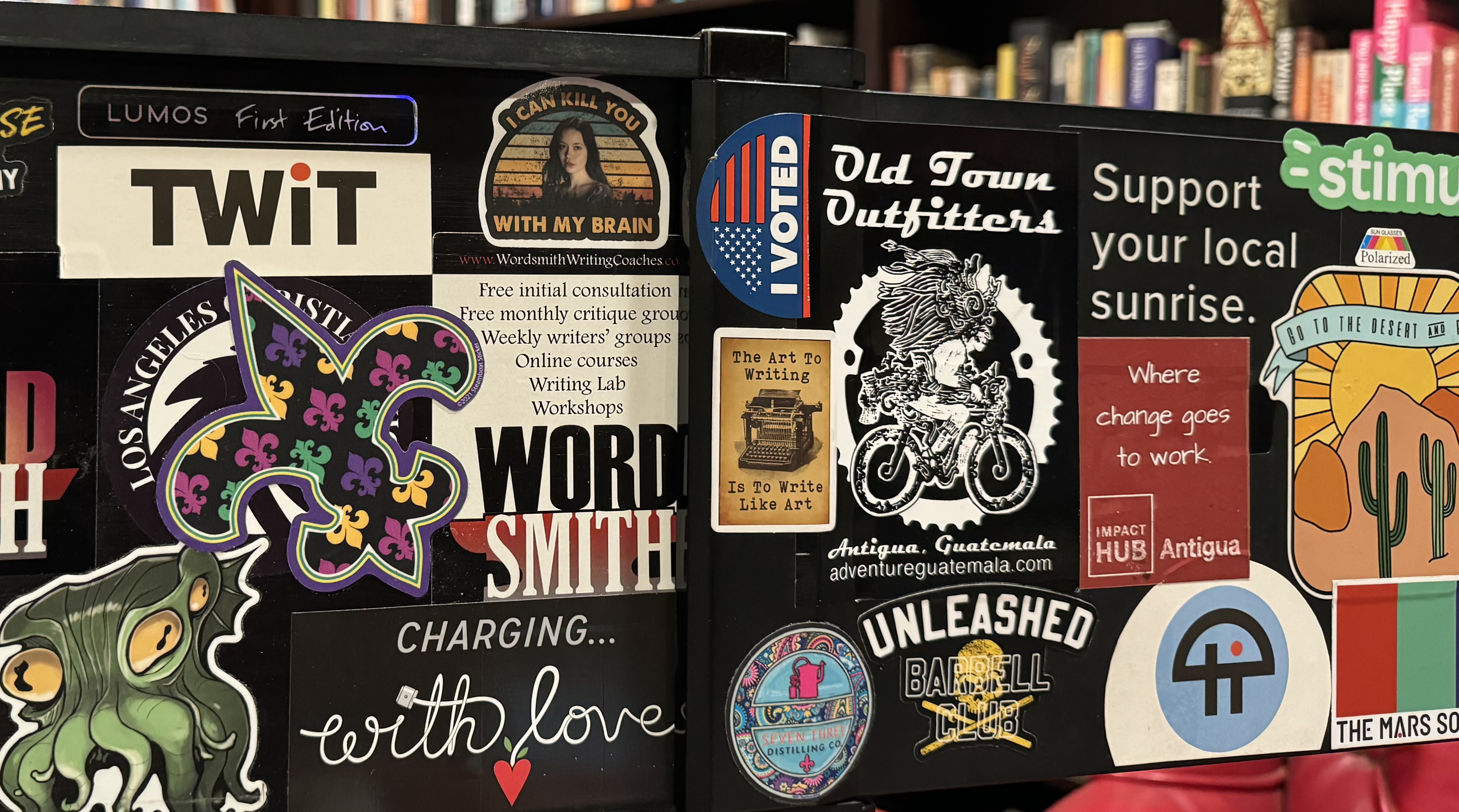 Nic's laptop sports lots of stickers crowded together